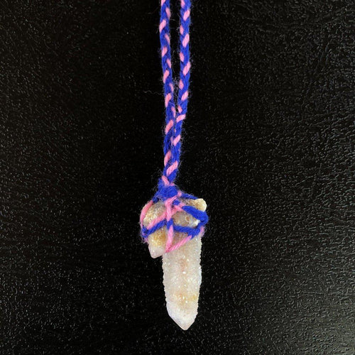 Spirit Quartz Crystal from South Africa, wrapped in pink and blue macramé style wool yarn.