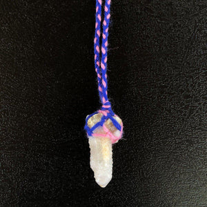 Spirit Quartz Crystal from South Africa, wrapped in pink and blue macramé style wool yarn.